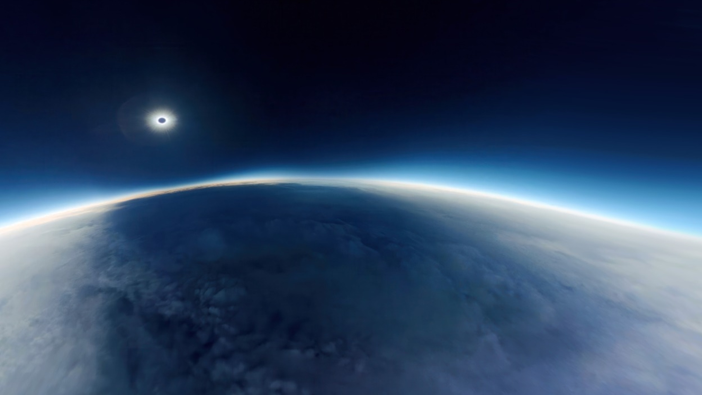 Total solar eclipse photographed from the stratosphere above Earth's curvature, by The Dorothy Project